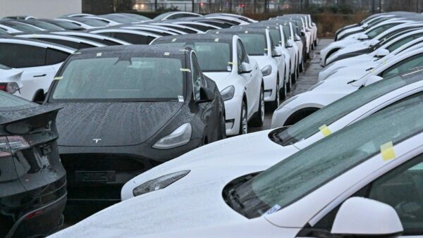 Unsold Teslas piling up in parking lots can be seen from space