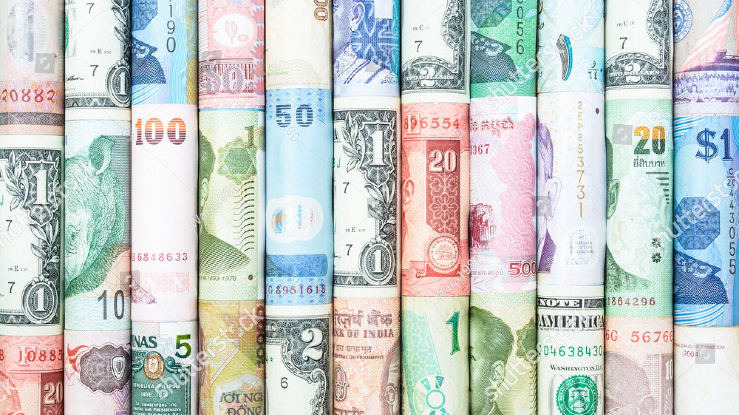 stock photo a backgrounds with colorful of many roll currency from many country 258312164 e1712128319228